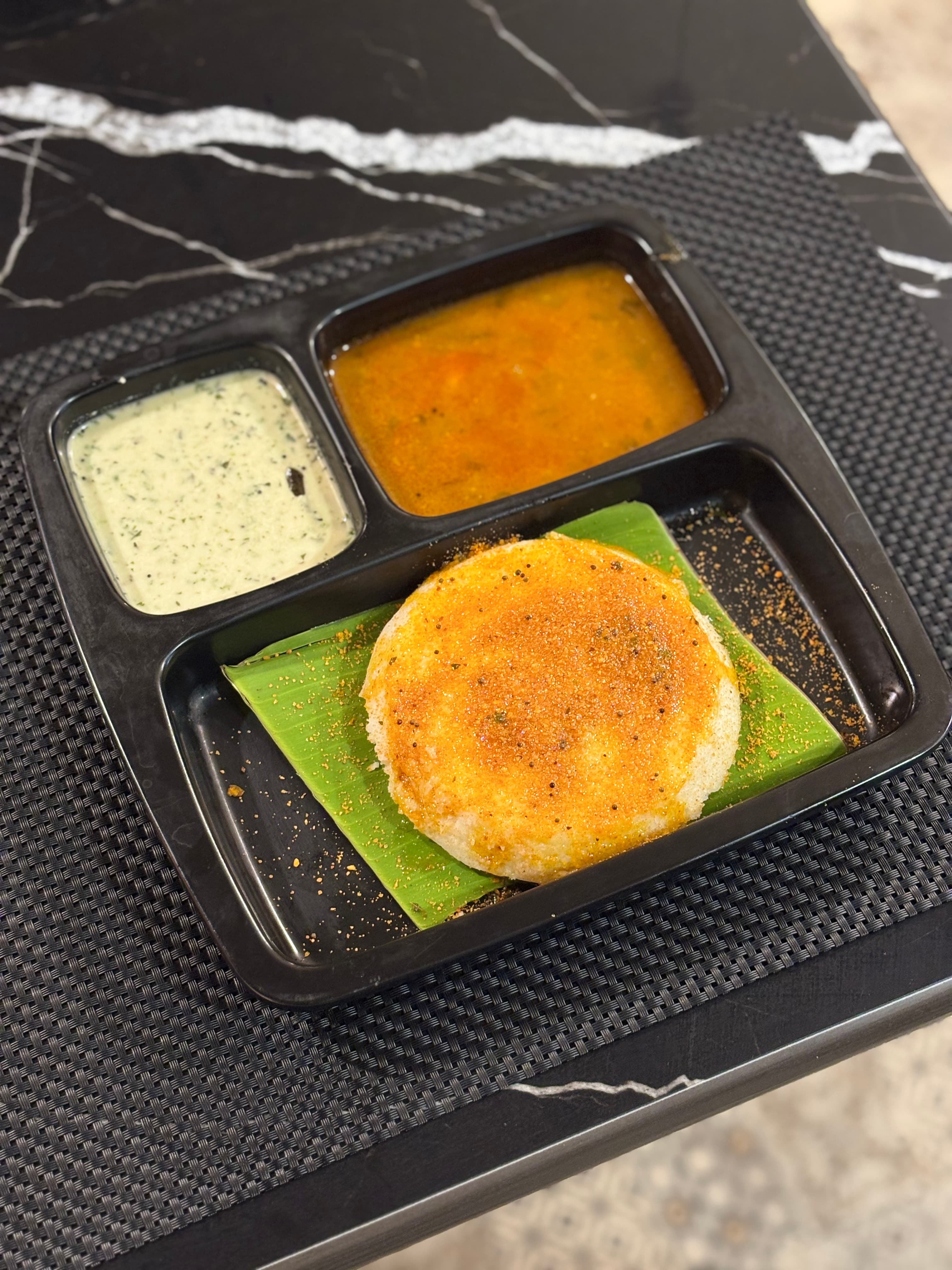 Soft steamed idli with chutney and sambar